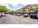 Well-maintained apartment building with a spacious parking lot and lush landscaping in a vibrant community at 1121 Basildon Rd, Mount Pleasant, SC 29466