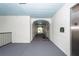 Well-lit hallway with elevator access, leading to condos 1117-1120 and 1121-1124 at 1121 Basildon Rd, Mount Pleasant, SC 29466
