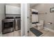 Bathroom and laundry room with a stacked washer and dryer, shower and tile flooring at 1121 Basildon Rd, Mount Pleasant, SC 29466