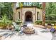 Outdoor community pavilion with a fire pit, seating, and lush landscaping for relaxation and social gatherings at 1121 Basildon Rd, Mount Pleasant, SC 29466