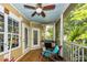 Inviting screened porch with comfortable seating, ceiling fan and a grilling station at 1121 Basildon Rd, Mount Pleasant, SC 29466