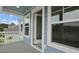 A covered balcony showing the exterior facade, paint, and door leading back into the interior at 116 Midmills Ln, Summerville, SC 29486