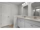 Bathroom with a double sink vanity, modern fixtures, and storage space at 116 Midmills Ln, Summerville, SC 29486