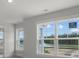 Sunlit bedroom with a scenic view of outdoor greenery and a beautiful blue sky at 116 Midmills Ln, Summerville, SC 29486
