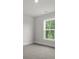 Bright bedroom with a view of lush greenery from the well-trimmed window at 116 Midmills Ln, Summerville, SC 29486