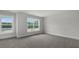 A roomy bedroom with carpeted floors, natural light, and beautiful outdoor scenery at 116 Midmills Ln, Summerville, SC 29486