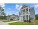 Street view of a row of new construction two-story homes, lawns, and sidewalks at 116 Midmills Ln, Summerville, SC 29486