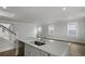 Open-concept kitchen boasts a large island with a sink and modern faucet and stainless steel dishwasher at 116 Midmills Ln, Summerville, SC 29486