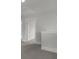 Upstairs landing with carpet and an attic access door as well as views into other rooms at 116 Midmills Ln, Summerville, SC 29486