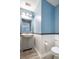 Powder room with new vanity, mirror, and neutral color scheme at 117 Ducane St, Summerville, SC 29483