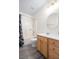 Bathroom features a shower and tub combination, gray vinyl flooring, and oak vanity at 117 Ducane St, Summerville, SC 29483
