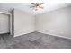 The spacious bedroom has neutral walls, carpet, and a ceiling fan at 117 Ducane St, Summerville, SC 29483