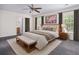 This bedroom features a ceiling fan, comfortable carpet, and is brightly lit from two large windows at 117 Ducane St, Summerville, SC 29483