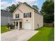 Two-story home featuring a one car garage, symmetrical windows, and a well-manicured front yard with shrubbery at 117 Ducane St, Summerville, SC 29483
