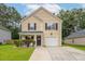 Charming two-story home with a well-manicured lawn and attached garage at 117 Ducane St, Summerville, SC 29483