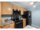 Modern kitchen featuring stainless steel appliances, granite countertops, and maple cabinetry at 117 Ducane St, Summerville, SC 29483