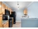 Contemporary kitchen equipped with granite countertops, modern appliances and maple cabinetry at 117 Ducane St, Summerville, SC 29483