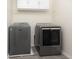 Laundry room with gray vinyl flooring and gray washer and dryer at 117 Ducane St, Summerville, SC 29483