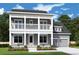 Charming two-story home with a welcoming front porch and balcony, complemented by a well-manicured lawn and a two-car garage at 1175 Reserve Ln, Awendaw, SC 29429