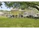Large backyard featuring a covered patio perfect for outdoor dining and relaxation at 125 Crooked Creek Ct, Summerville, SC 29486