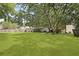 Expansive backyard with mature trees, offering privacy and space for outdoor activities at 125 Crooked Creek Ct, Summerville, SC 29486