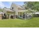 Expansive backyard featuring a covered patio, lush lawn, and well-maintained landscaping at 125 Crooked Creek Ct, Summerville, SC 29486