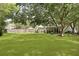 Spacious backyard with mature trees offering shade and privacy, enhancing outdoor enjoyment at 125 Crooked Creek Ct, Summerville, SC 29486