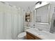Neutral bathroom with a shower/tub, framed mirror, and vanity with wood cabinetry at 125 Crooked Creek Ct, Summerville, SC 29486