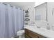 Bathroom with tile flooring, a shower/tub with curtain, and standard fixtures at 125 Crooked Creek Ct, Summerville, SC 29486