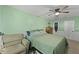 Cozy bedroom with green walls, a comfortable lounge chair, and standard furnishings at 125 Crooked Creek Ct, Summerville, SC 29486
