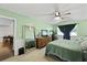 Bright bedroom featuring neutral carpet, an oversized mirror, and a view to the backyard at 125 Crooked Creek Ct, Summerville, SC 29486
