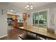Dining area featuring wooden table and access to the kitchen and backyard at 125 Crooked Creek Ct, Summerville, SC 29486