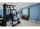 Home gym/office combo with an exercise machine, office setup, and neutral carpet at 125 Crooked Creek Ct, Summerville, SC 29486
