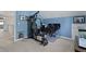 Home gym/office combo featuring an exercise machine, office setup, and modern decor at 125 Crooked Creek Ct, Summerville, SC 29486