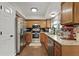 Well-equipped kitchen with granite countertops, stainless steel appliances, and wood cabinets at 125 Crooked Creek Ct, Summerville, SC 29486