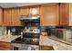 Well-equipped kitchen with granite countertops, stainless appliances, and navy subway tile backsplash at 125 Crooked Creek Ct, Summerville, SC 29486