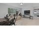 Living room with comfortable seating, exercise equipment and a window with a view at 125 Crooked Creek Ct, Summerville, SC 29486
