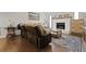 Open-concept living room featuring a fireplace, hardwood floors, and comfortable seating at 125 Crooked Creek Ct, Summerville, SC 29486