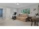 Living room featuring comfortable seating and exercise equipment with a bright window at 125 Crooked Creek Ct, Summerville, SC 29486
