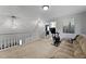 Upstairs living room with carpet, comfortable seating and exercise equipment at 125 Crooked Creek Ct, Summerville, SC 29486