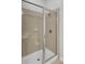 A glass enclosed tile shower with a built-in seat at 125 Pier View St # 209, Charleston, SC 29492