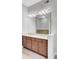 Bright bathroom vanity with double sinks, bright lighting, and light-colored countertops at 125 Pier View St # 209, Charleston, SC 29492