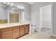 Bright bathroom with a double sink vanity, walk-in shower and tile flooring at 125 Pier View St # 209, Charleston, SC 29492