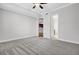 Bedroom showing neutral carpet, view to bathroom, and neutral walls and trim at 125 Pier View St # 209, Charleston, SC 29492