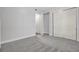 Neutral bedroom with carpet, large closet, and access to hallway at 125 Pier View St # 209, Charleston, SC 29492