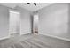 Bedroom featuring grey walls and carpet with an open door to the hallway at 125 Pier View St # 209, Charleston, SC 29492