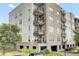 Exterior view of a condo building highlighting its balconies and architecture at 125 Pier View St # 209, Charleston, SC 29492
