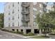 Multi-story condo building featuring balconies, brick accents, and well-maintained landscaping at 125 Pier View St # 209, Charleston, SC 29492