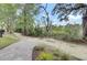 Lushly landscaped grounds and a winding gravel path create a tranquil outdoor experience at 125 Pier View St # 209, Charleston, SC 29492