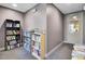 Reading room with shelves full of books and a glass-windowed door at 125 Pier View St # 209, Charleston, SC 29492
